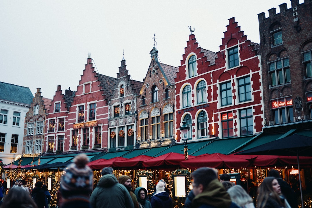Colorful historic buildings line a bustling market square
